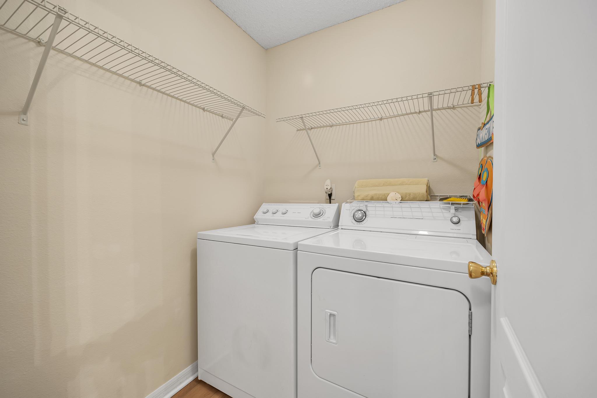 724 Ginger Mill Drive St. Johns, FL 32259 - Photo 24 of 54 a utility room with dryer and washer