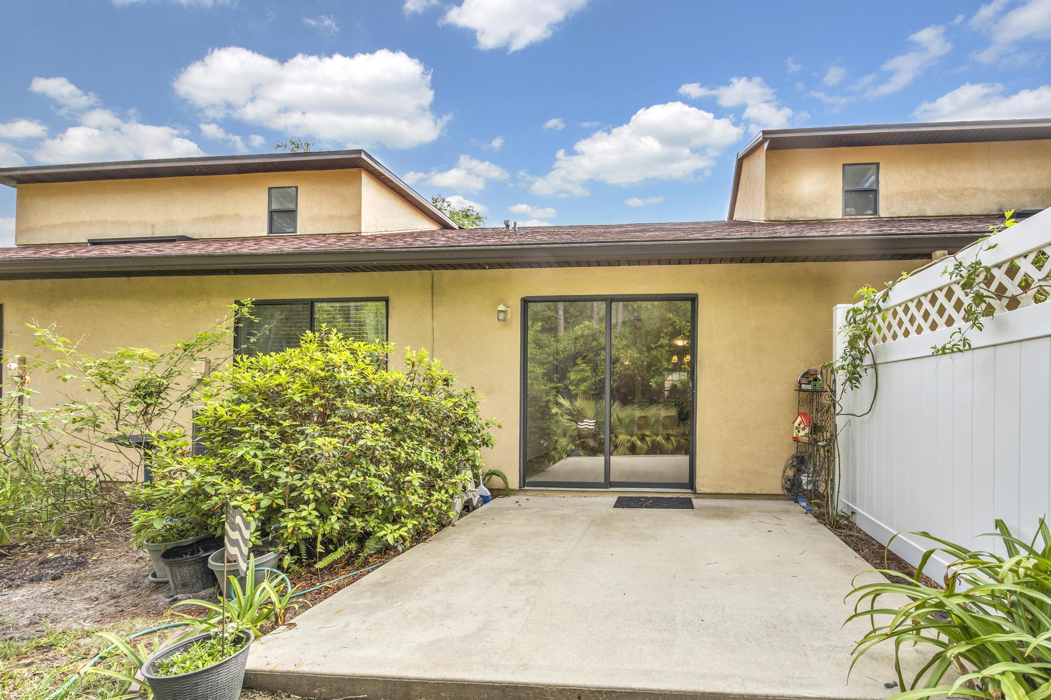 724 Ginger Mill Drive St. Johns, FL 32259 - Photo 25 of 54 a view of a house with a yard