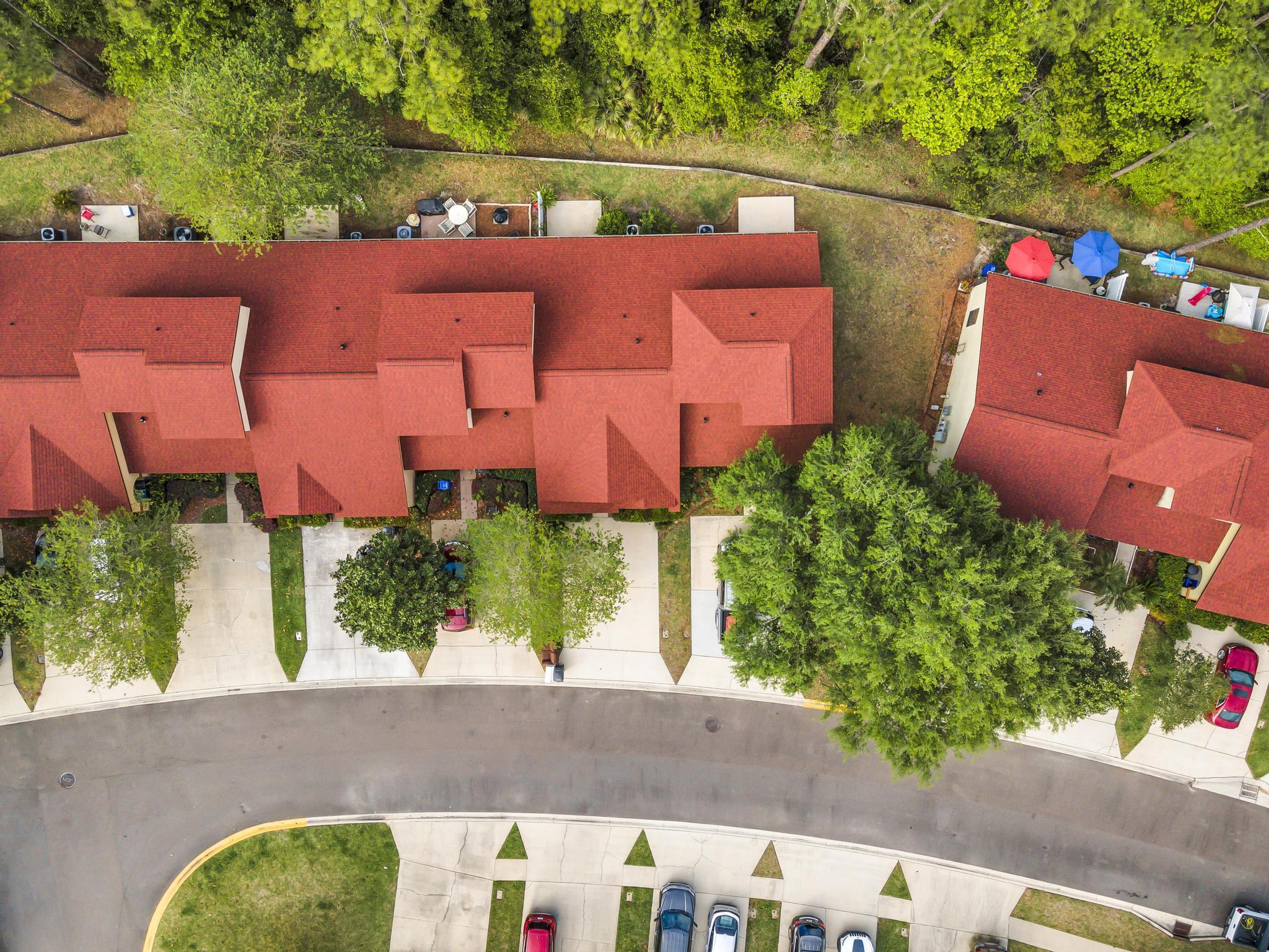 724 Ginger Mill Drive St. Johns, FL 32259 - Photo 3 of 54 an aerial view of a house with a yard and outdoor seating