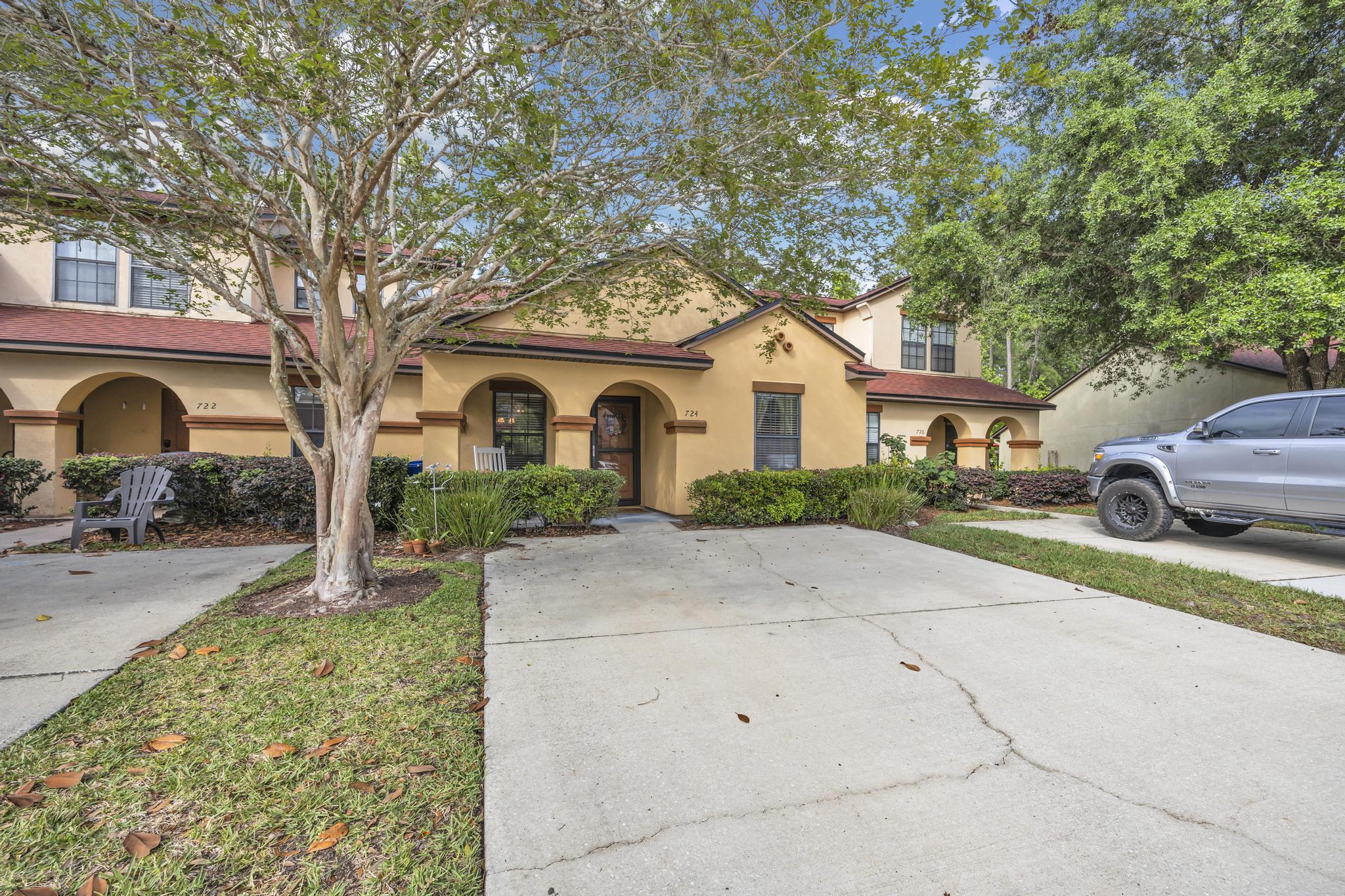 724 Ginger Mill Drive St. Johns, FL 32259 - Photo 46 of 54 a front view of a house with garden