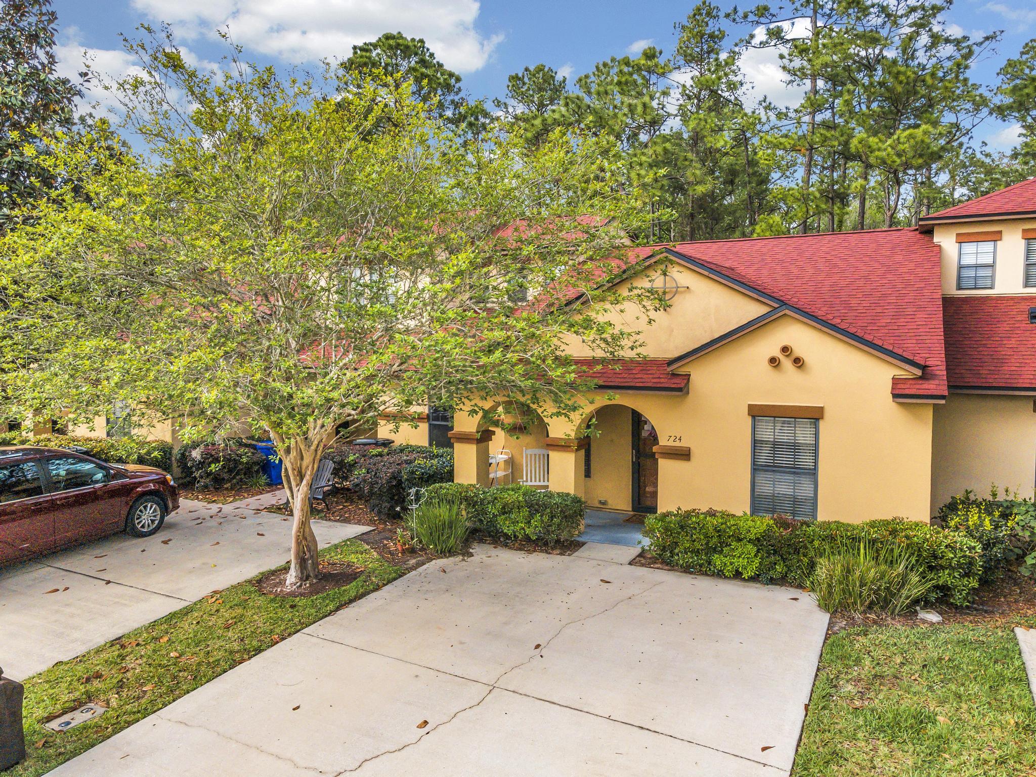 724 Ginger Mill Drive St. Johns, FL 32259 - Photo 49 of 54 a front view of a house with garden