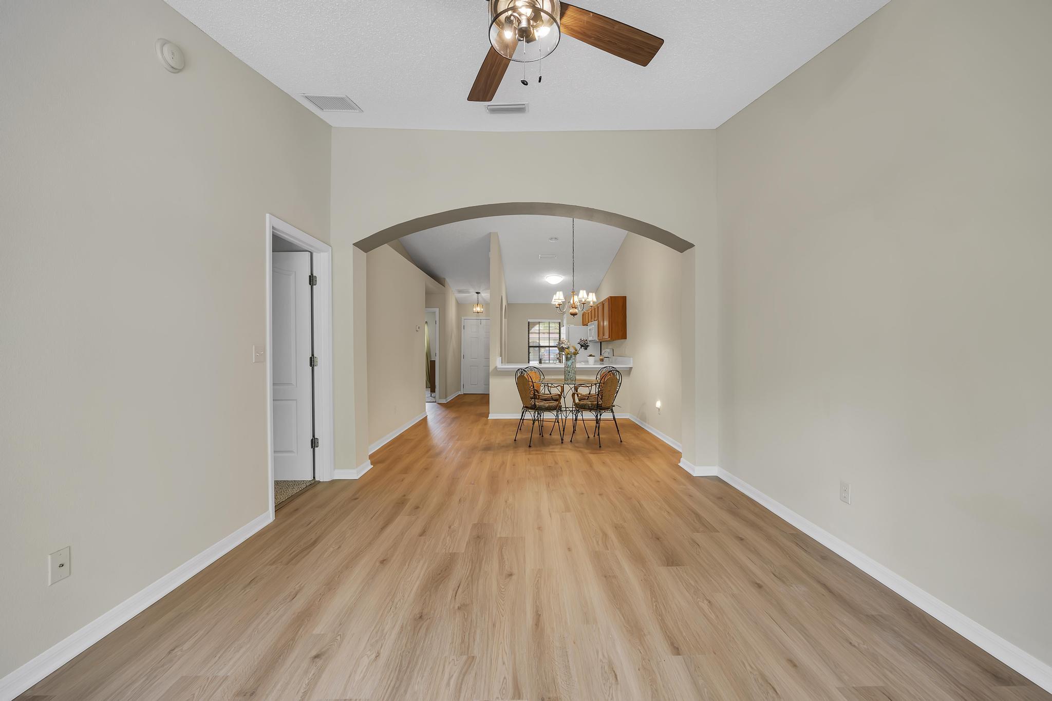 724 Ginger Mill Drive St. Johns, FL 32259 - Photo 6 of 54 a view of a livingroom with wooden floor