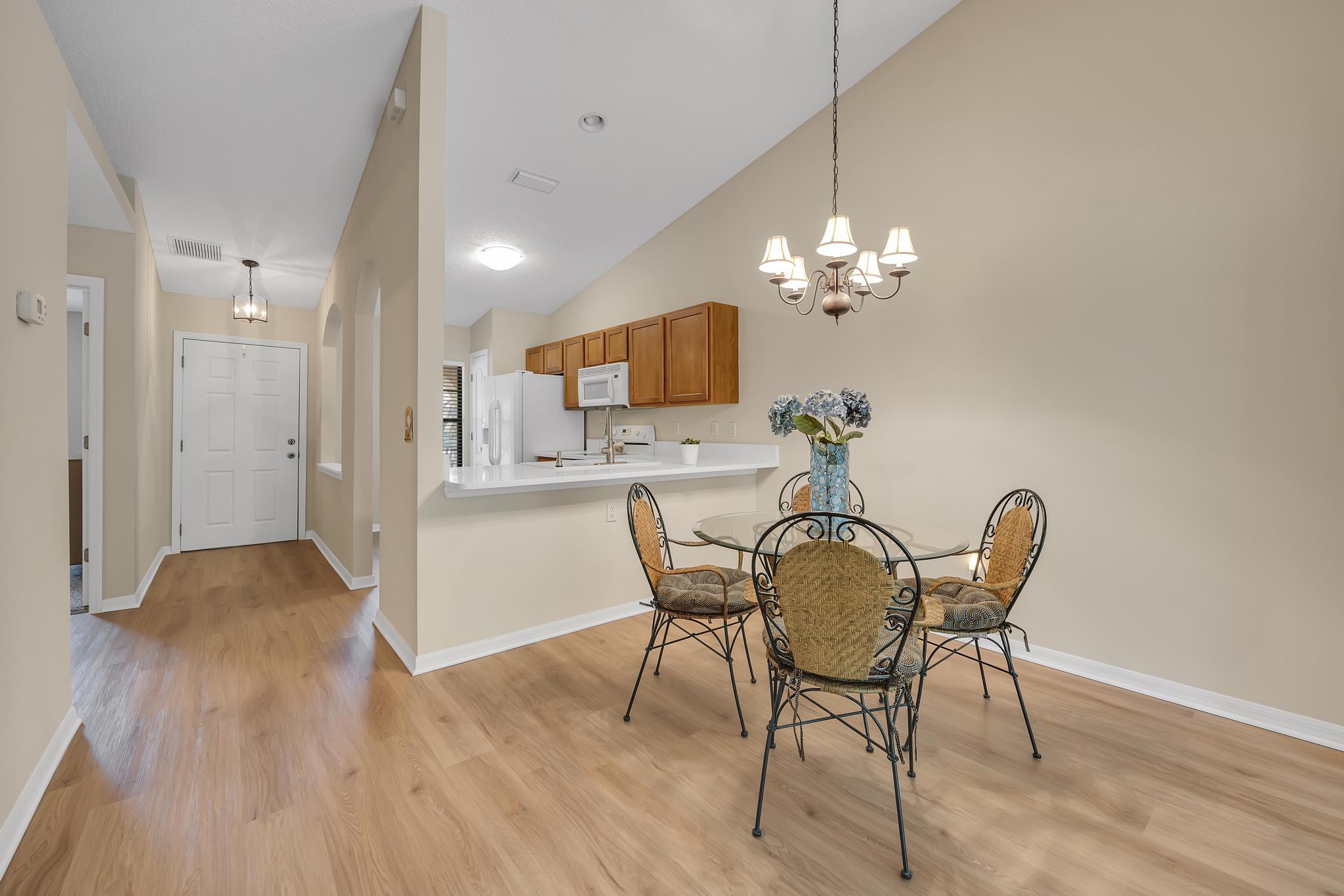 724 Ginger Mill Drive St. Johns, FL 32259 - Photo 9 of 54 a dining room with furniture and chandelier
