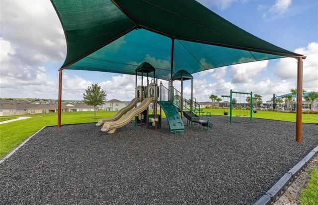 a view of a park with swings
