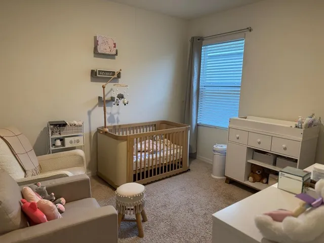 a bedroom with a bed and a couch