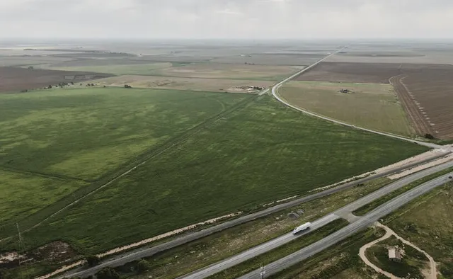 a view of outdoor space with wooden floor
