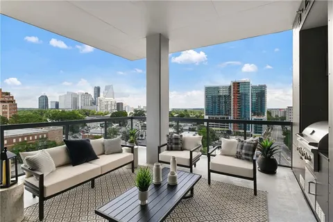 a living room with furniture and a table