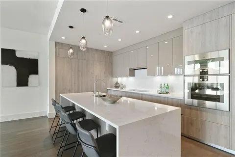 a bedroom with a large bed and a large window