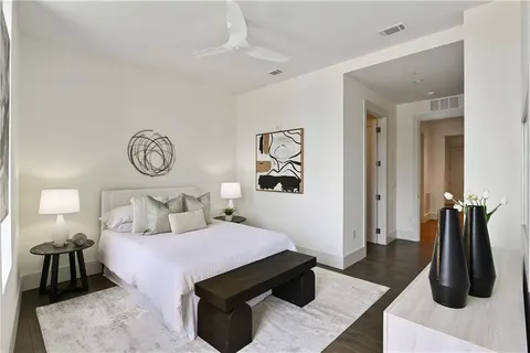 a en suite bathroom with a tub mirror and window