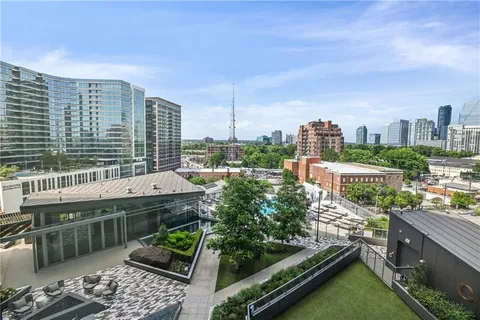 a view of a patio with couches and potted plants