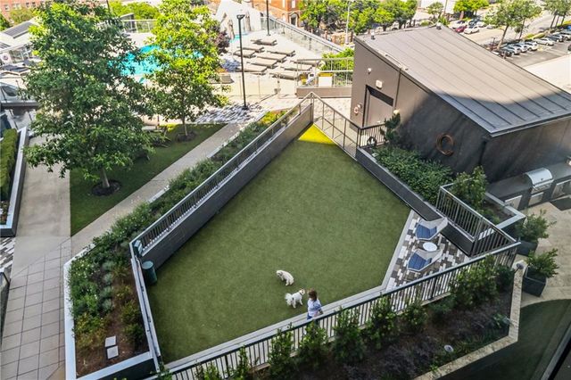a view of a house with a yard and sitting area