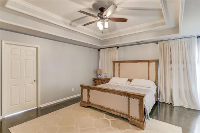 a room with a bed and a chandelier