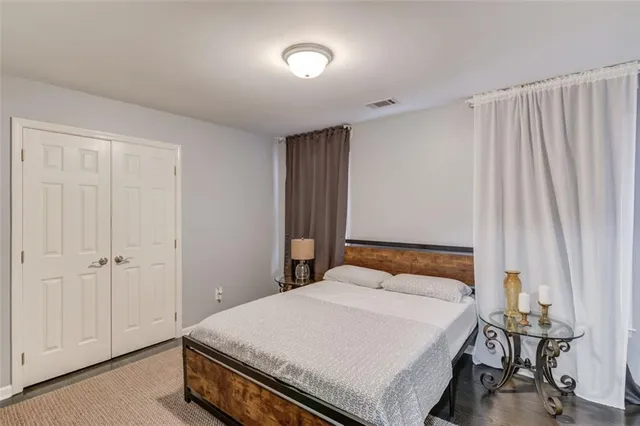 a bedroom with a bed and a table