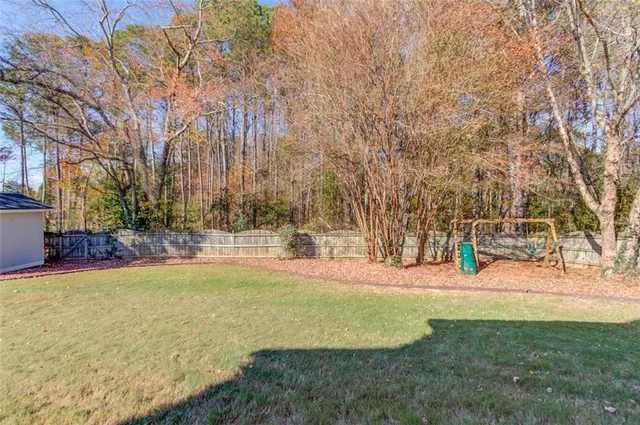 a view of yard with swimming pool