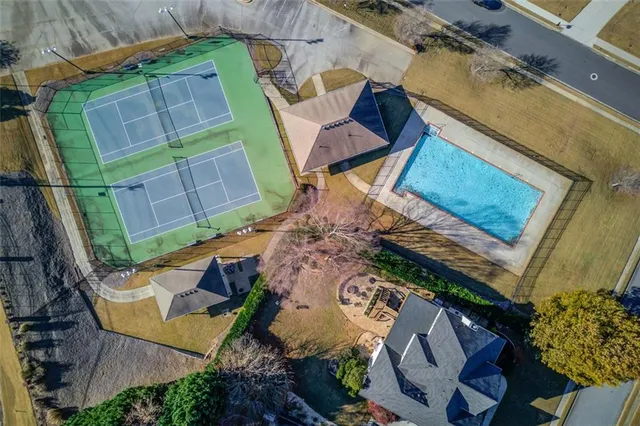 an aerial view of a house with a yard