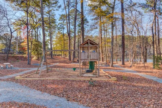 a backyard of apartments with large trees