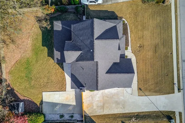 an aerial view of a house with swimming pool