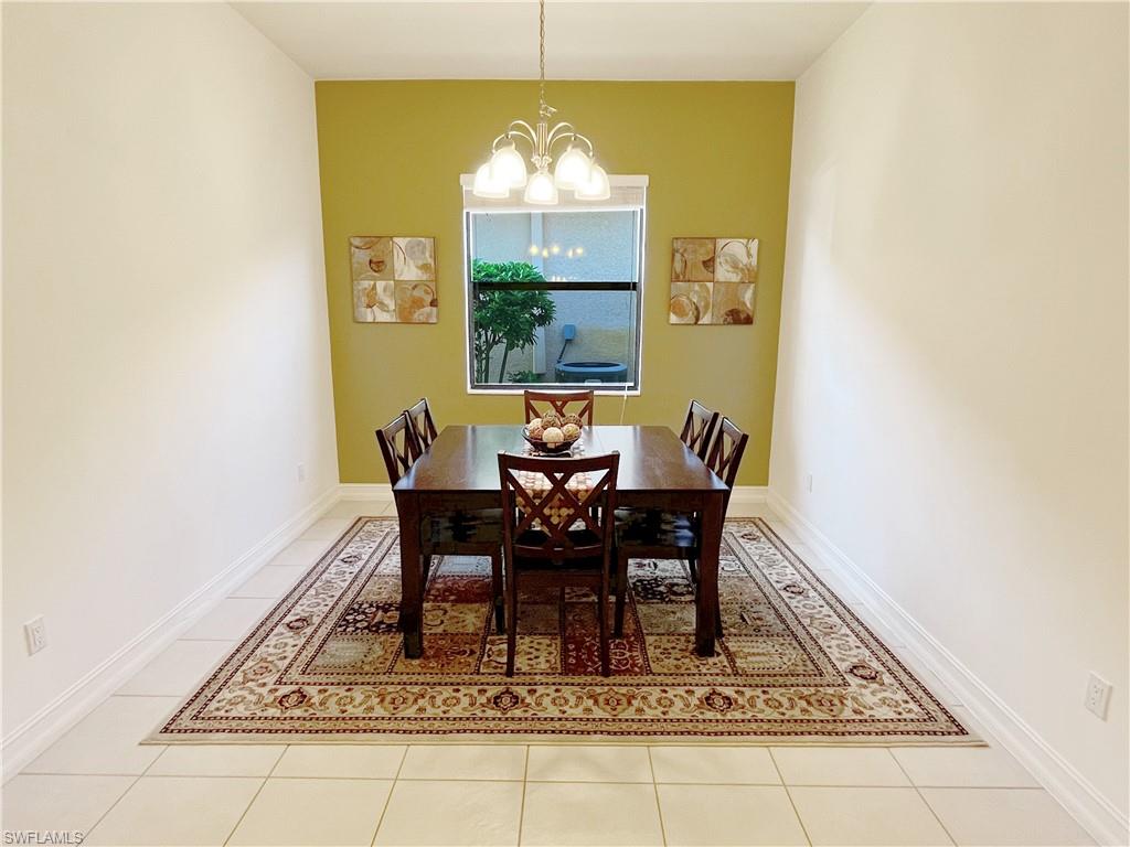1366 Serrano Circle Naples, FL 34105 - Photo 13 of 30 a view of a dining room with furniture