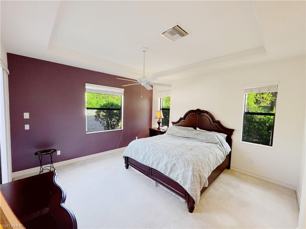 1366 Serrano Circle Naples, FL 34105 - Photo 15 of 30 a bedroom with a bed dresser and a window