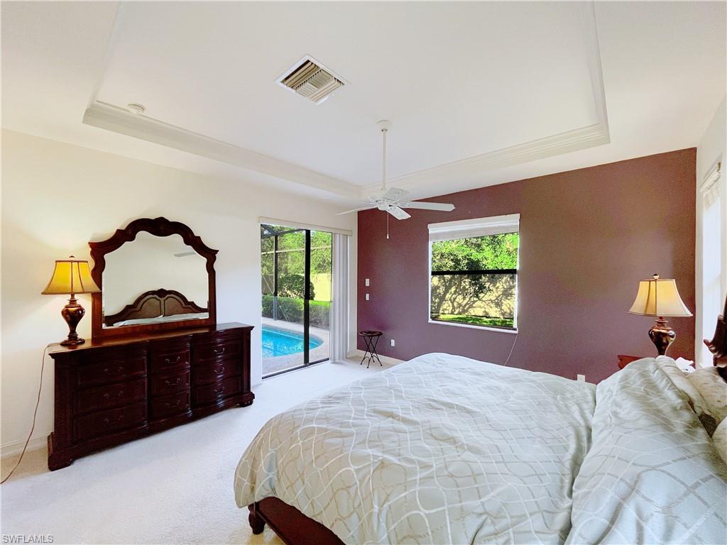 1366 Serrano Circle Naples, FL 34105 - Photo 16 of 30 a bedroom with a bed and a dresser