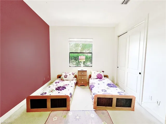 a view of utility room with two washing machine