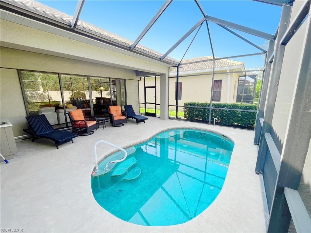 1366 Serrano Circle Naples, FL 34105 - Photo 2 of 30 a view of a livingroom with furniture hardwood floor and windows
