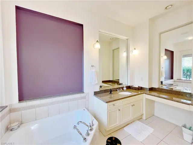 a kitchen with a sink cabinets and a stove
