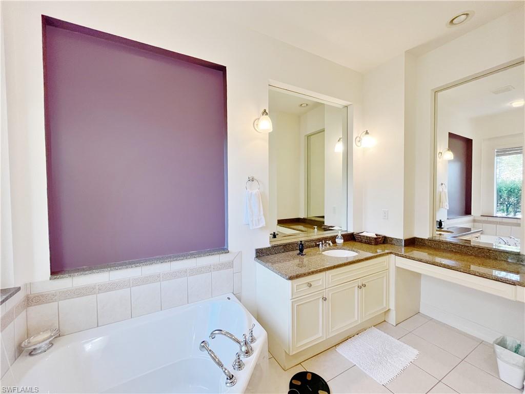 1366 Serrano Circle Naples, FL 34105 - Photo 25 of 30 a kitchen with a sink cabinets and a stove