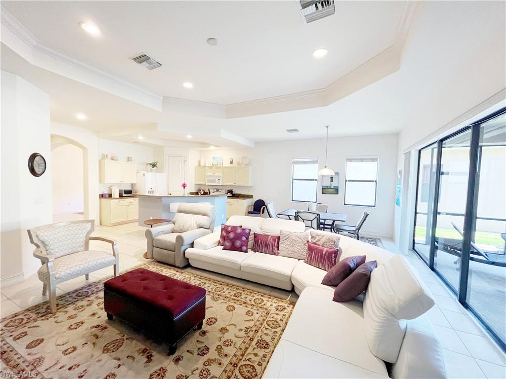 1366 Serrano Circle Naples, FL 34105 - Photo 10 of 30 a living room with furniture or rug and a large window
