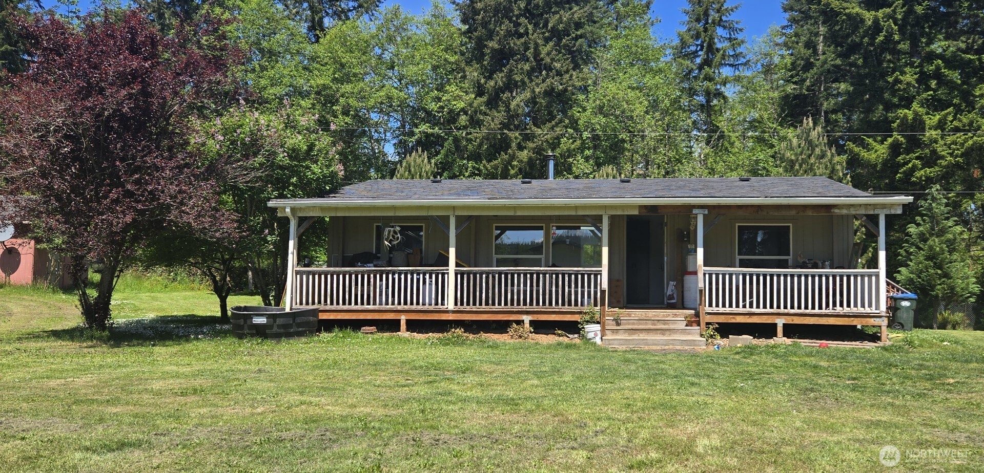 123 Barton Road Rochester, WA 98579 - Photo 1 of 25 a front view of a house with a garden