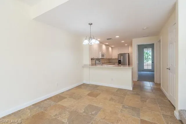 a view of a kitchen with a sink