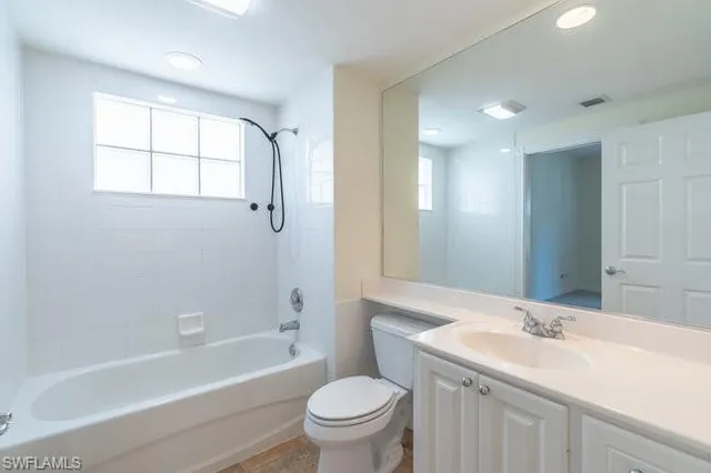 a bathroom with a sink a toilet and a bathtub