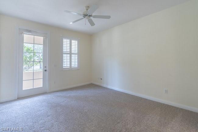 8108 Josefa Way Naples, FL 34114 - Photo 18 of 40 an empty room with windows and fan