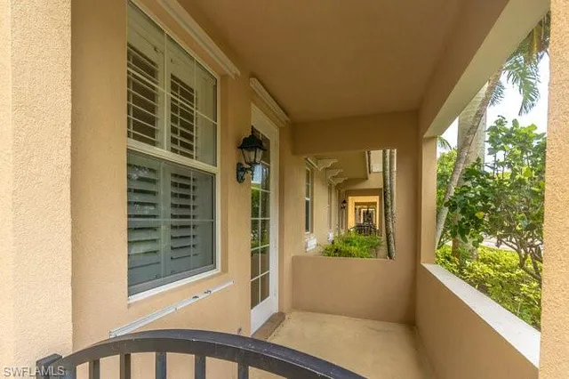 a view of balcony with potted plants