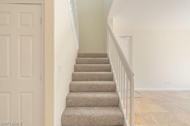 8108 Josefa Way Naples, FL 34114 - Photo 22 of 40 a view of staircase with white walls