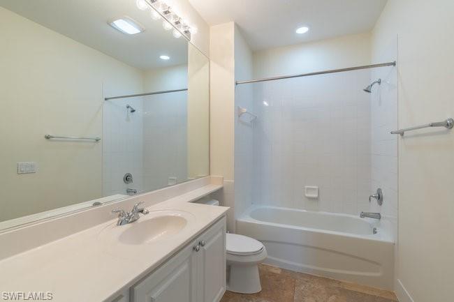 8108 Josefa Way Naples, FL 34114 - Photo 25 of 40 a bathroom with a double vanity sink toilet mirror and shower