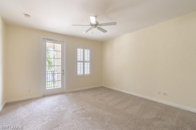 8108 Josefa Way Naples, FL 34114 - Photo 26 of 40 an empty room with windows and fan