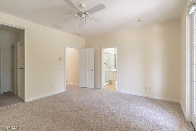 8108 Josefa Way Naples, FL 34114 - Photo 27 of 40 a view of empty room with a ceiling fan
