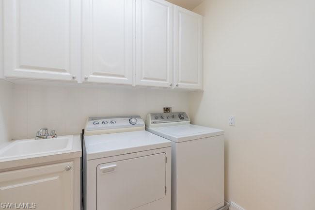 8108 Josefa Way Naples, FL 34114 - Photo 33 of 40 a view of storage and utility room with washer and dryer