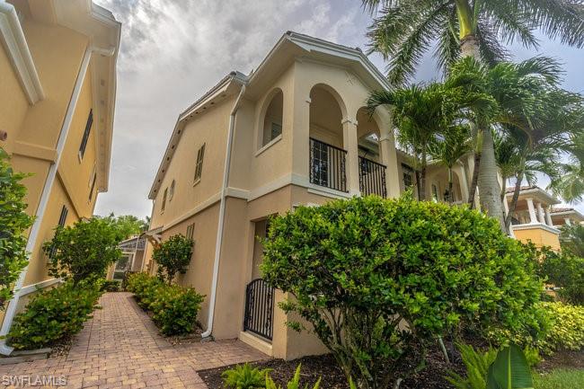 8108 Josefa Way Naples, FL 34114 - Photo 4 of 40 a front view of a multi story residential apartment buildings