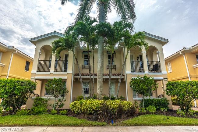 8108 Josefa Way Naples, FL 34114 - Photo 5 of 40 a front view of a house with a garden