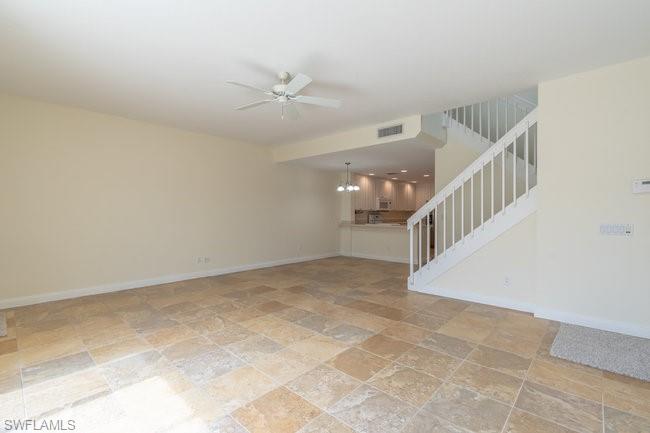 8108 Josefa Way Naples, FL 34114 - Photo 9 of 40 a view of an empty room with stairs