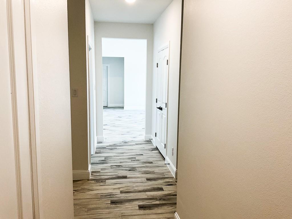 201 Bluff Court Godley, TX 76044 - Photo 12 of 15 a view of a bathroom with wooden floor