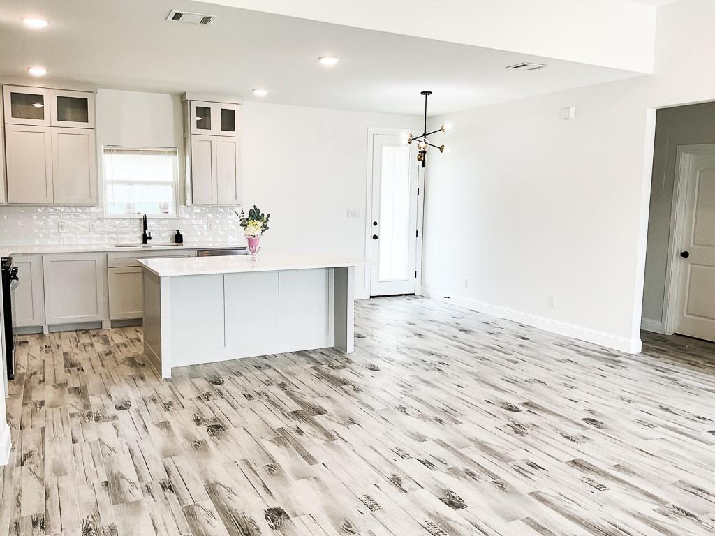 201 Bluff Court Godley, TX 76044 - Photo 3 of 15 a view of kitchen with sink microwave and refrigerator