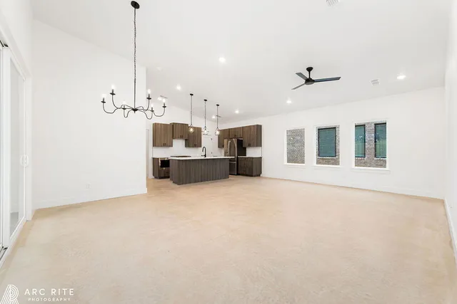 a view of a kitchen with a sink and a fireplace