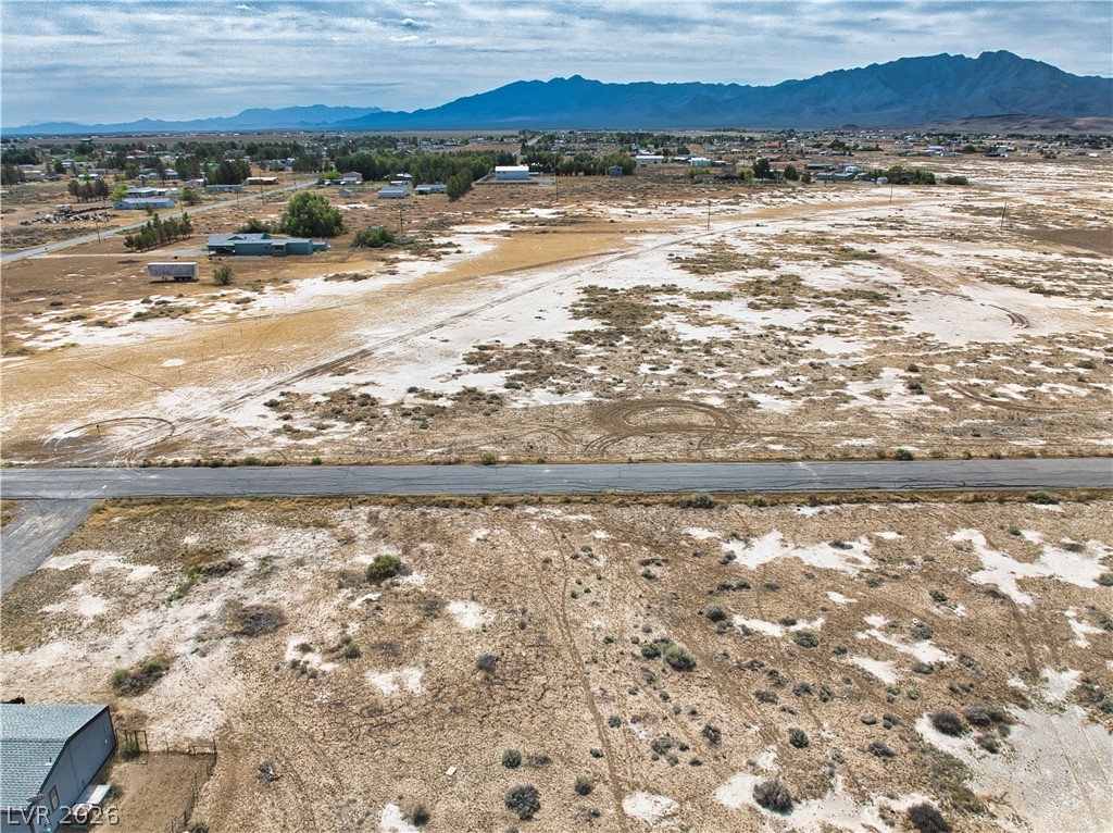 3591 West Wilson Road Pahrump, NV 89048 - Photo 3 of 12 View of mountain backdrop with a desert landscape and rural landscape
