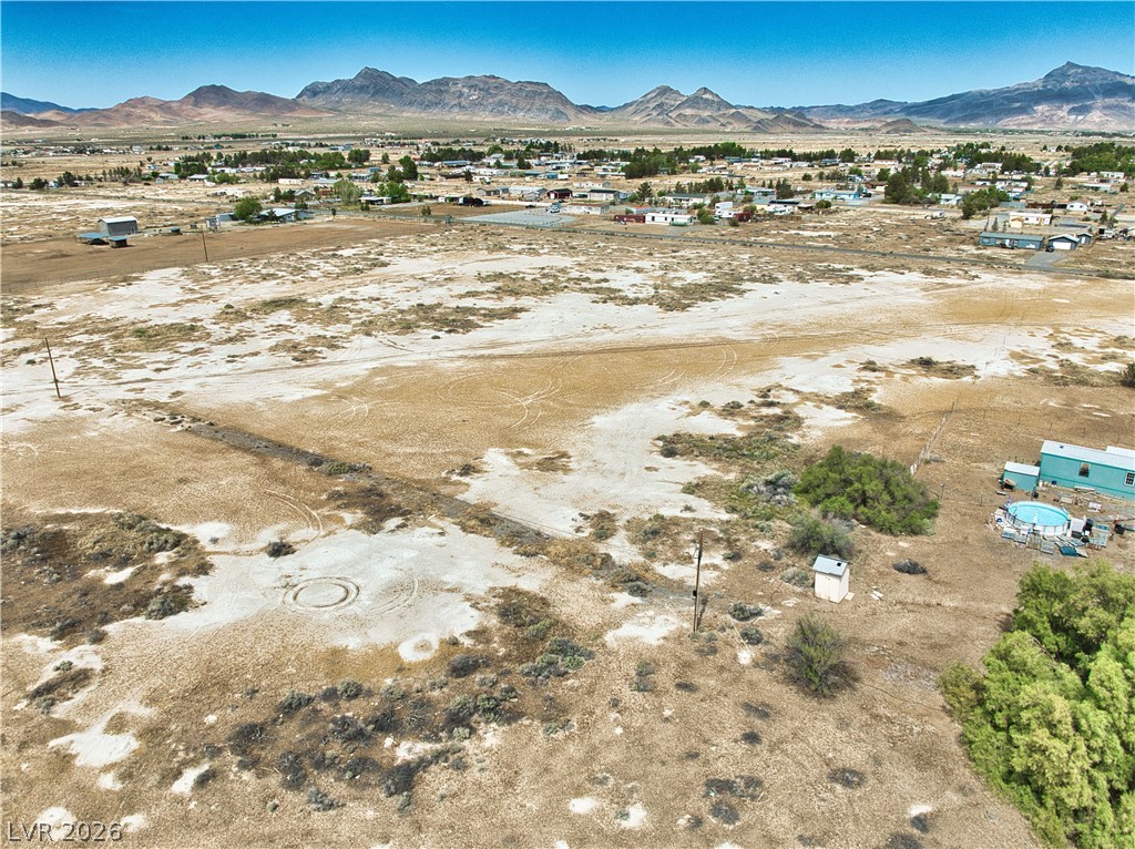 3591 West Wilson Road Pahrump, NV 89048 - Photo 7 of 12 View of mountain background featuring rural landscape and nearby suburban area