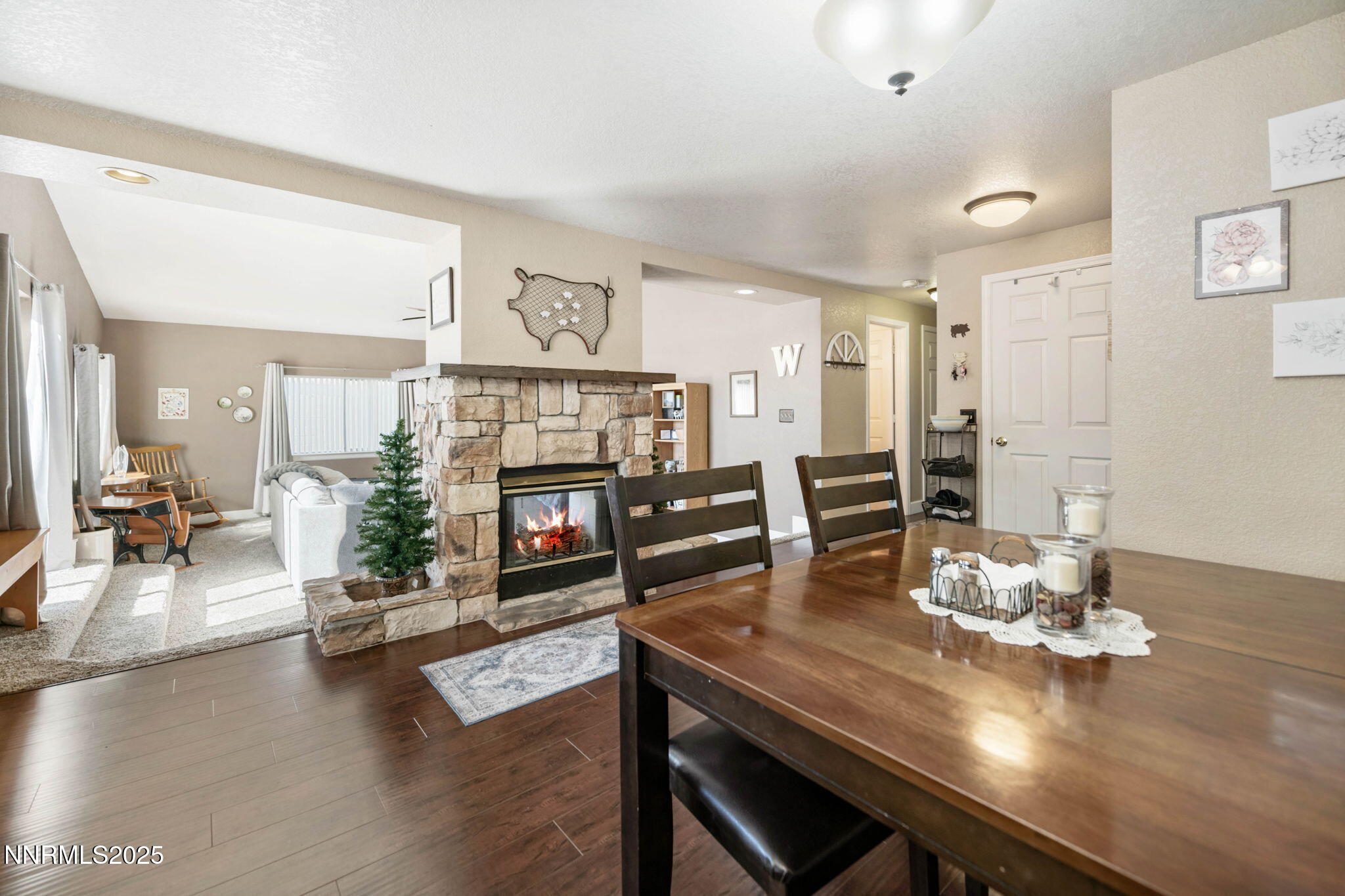 3574 Haystack Drive Carson City, NV 89705 - Photo 5 of 39 a living room with fireplace furniture and a wooden floor