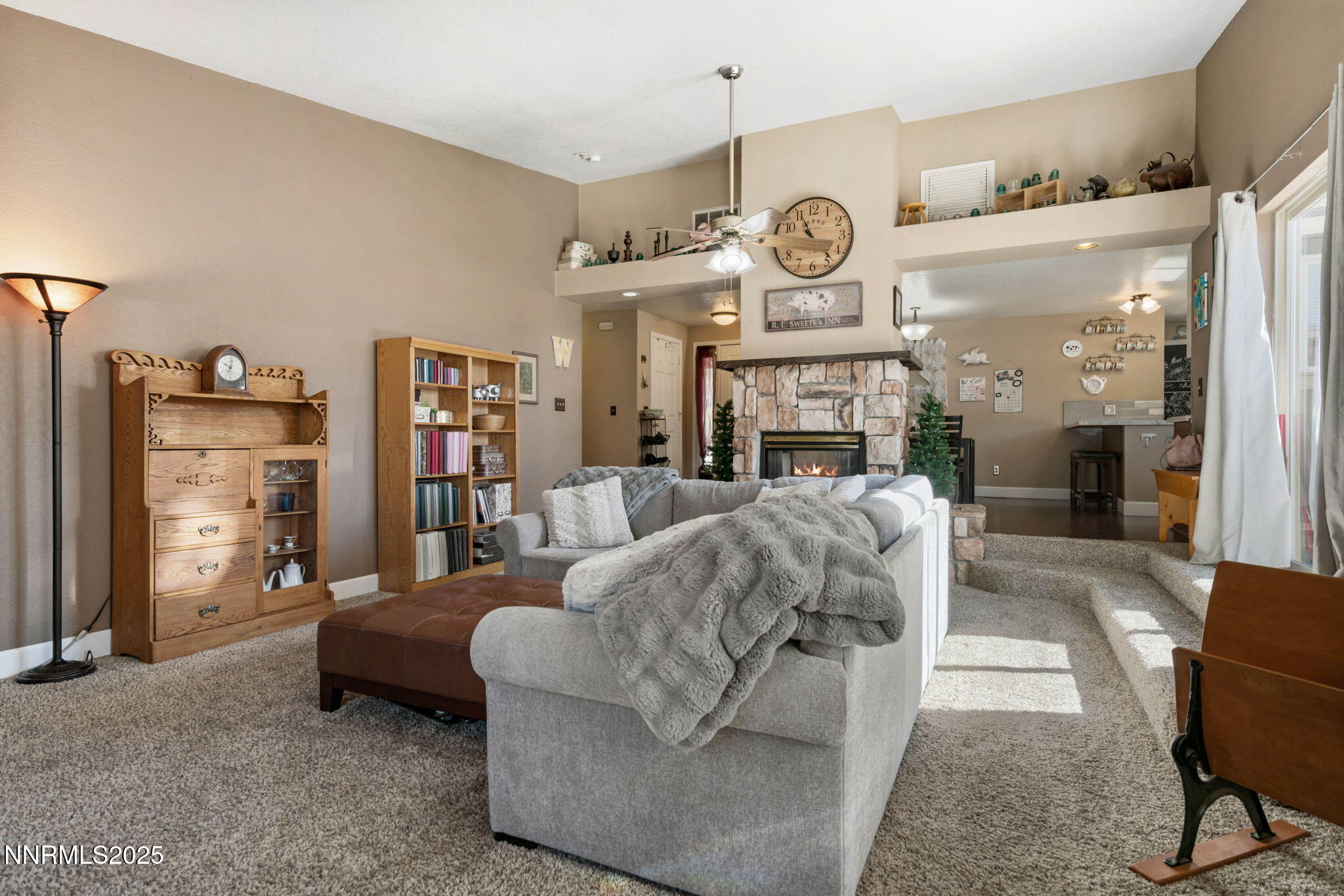 3574 Haystack Drive Carson City, NV 89705 - Photo 9 of 39 a living room with furniture a clock and a large mirror