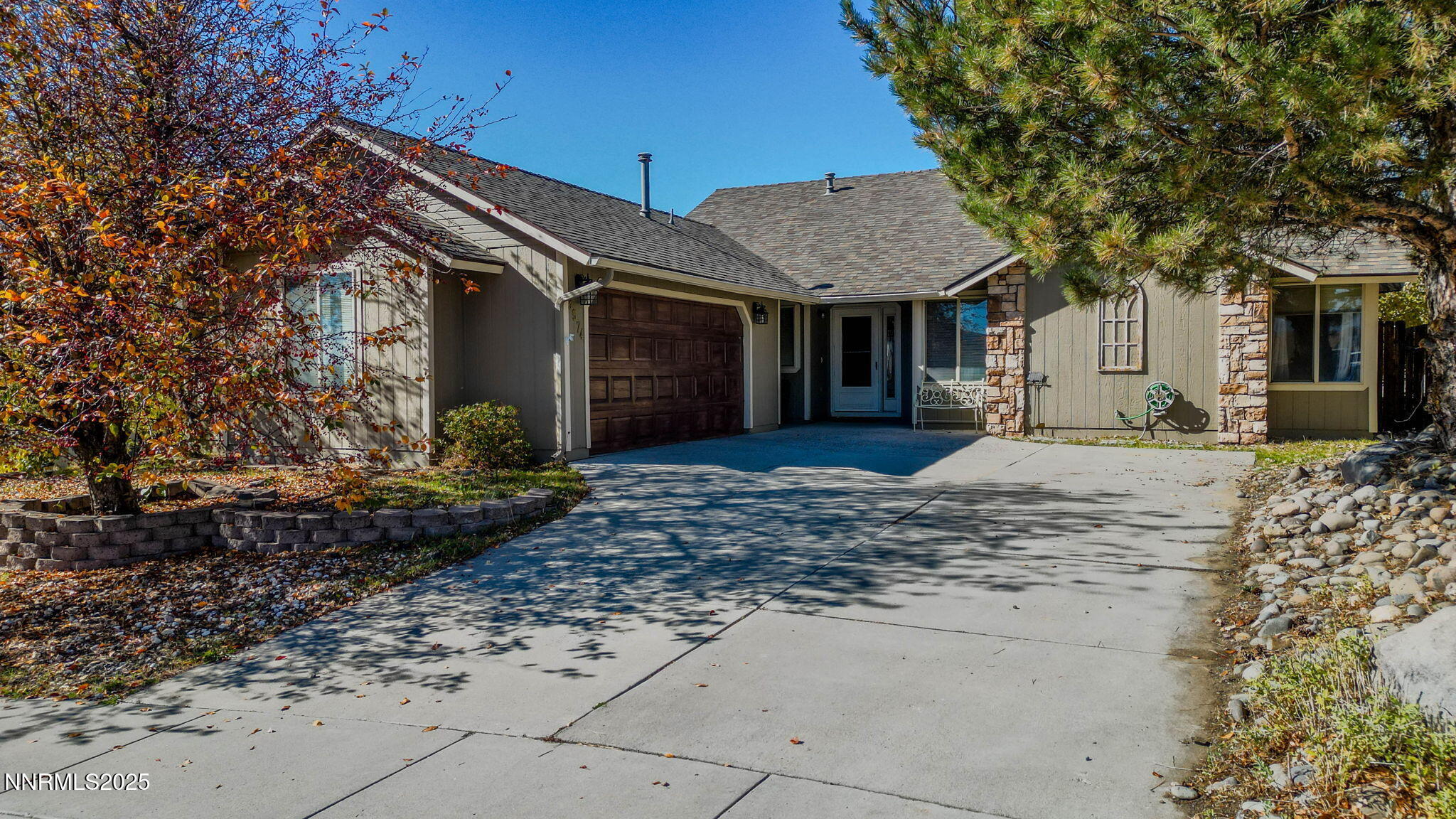 3574 Haystack Drive Carson City, NV 89705 - Photo 10 of 39 a front view of a house with a yard and tree